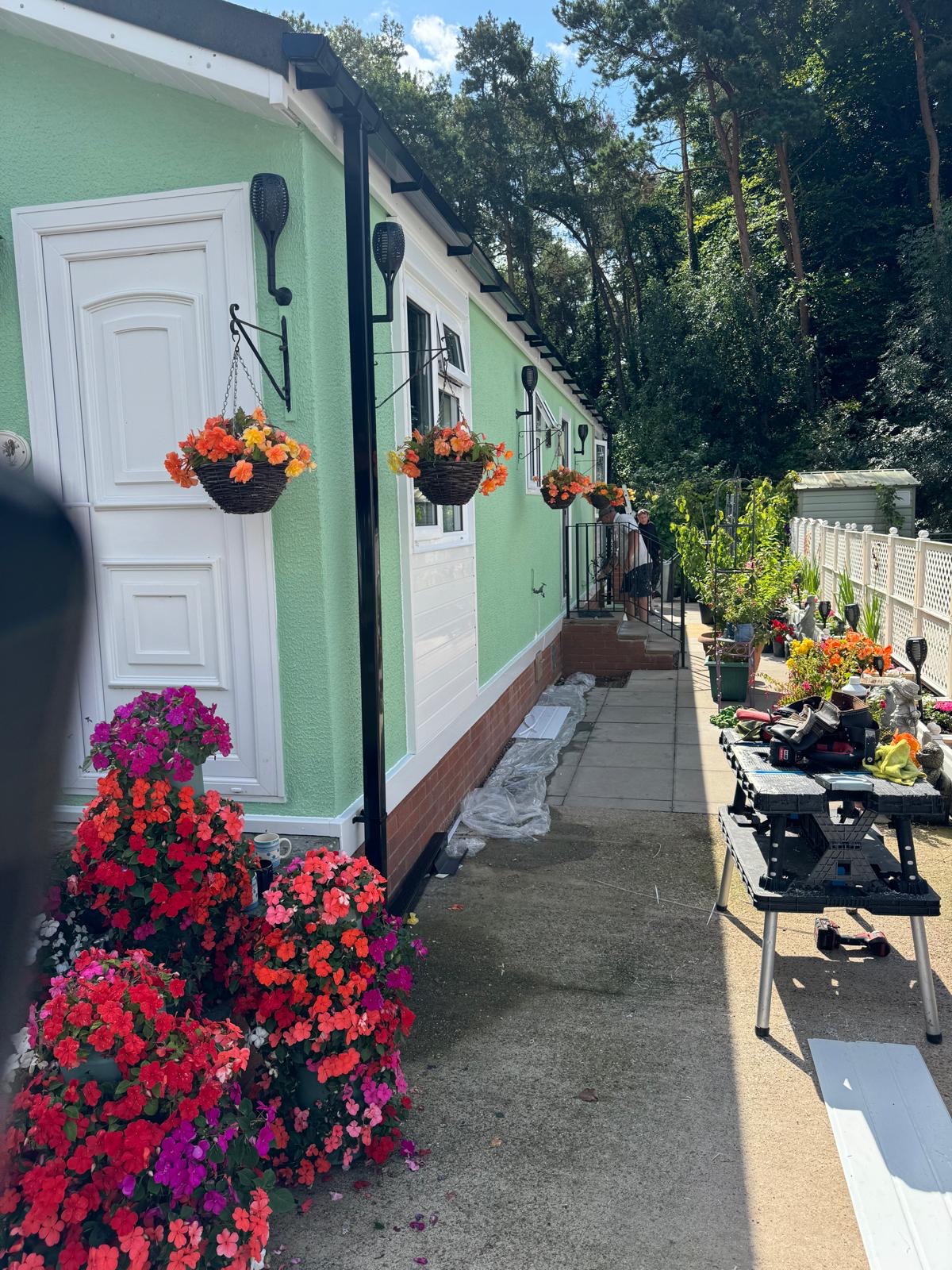 Renovated park home with garden flowers in bloom