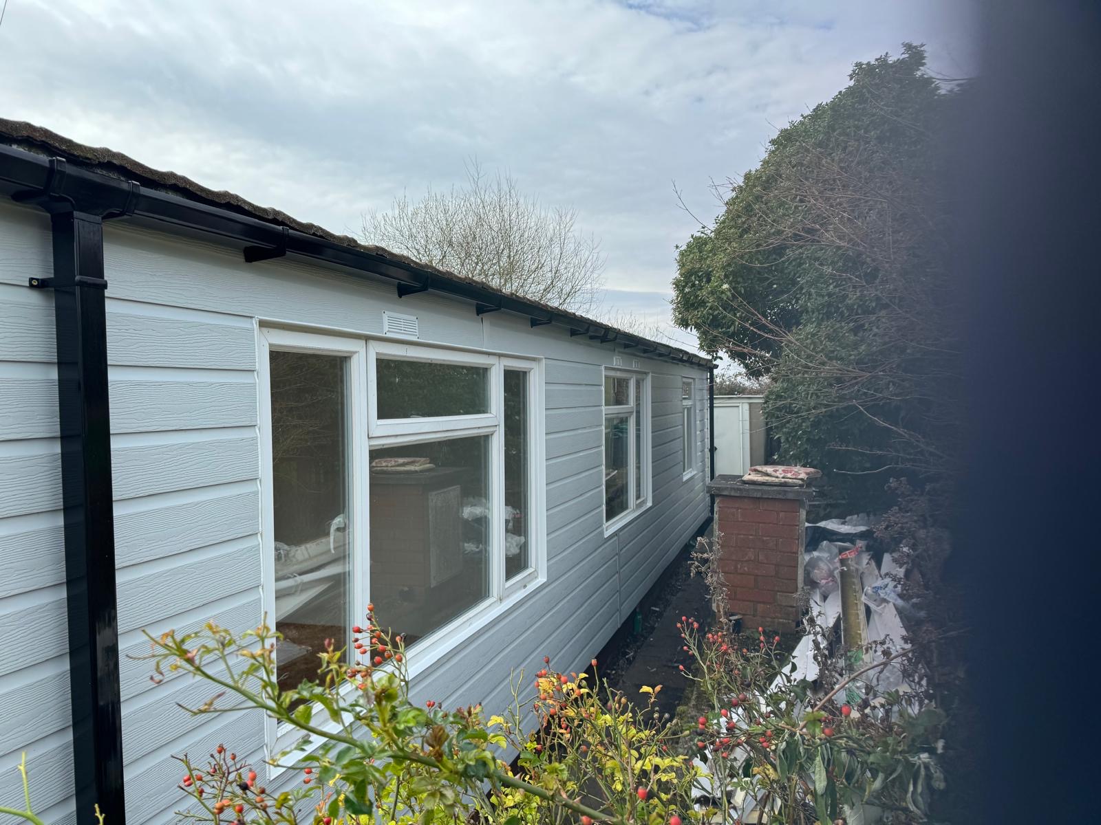 Side view of grey clad park home