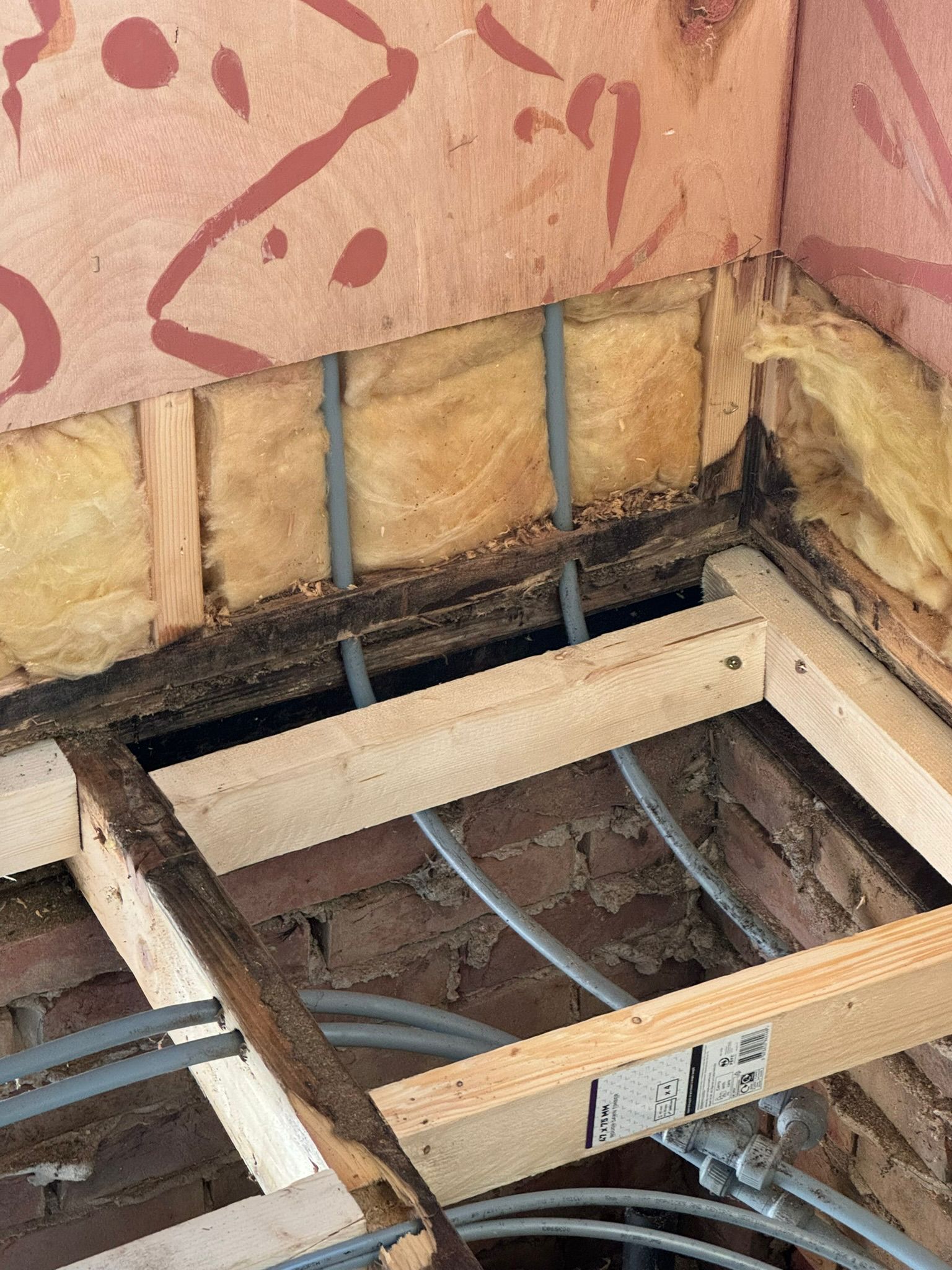 New timber floor joists fitted over the brick base during structural interior repair