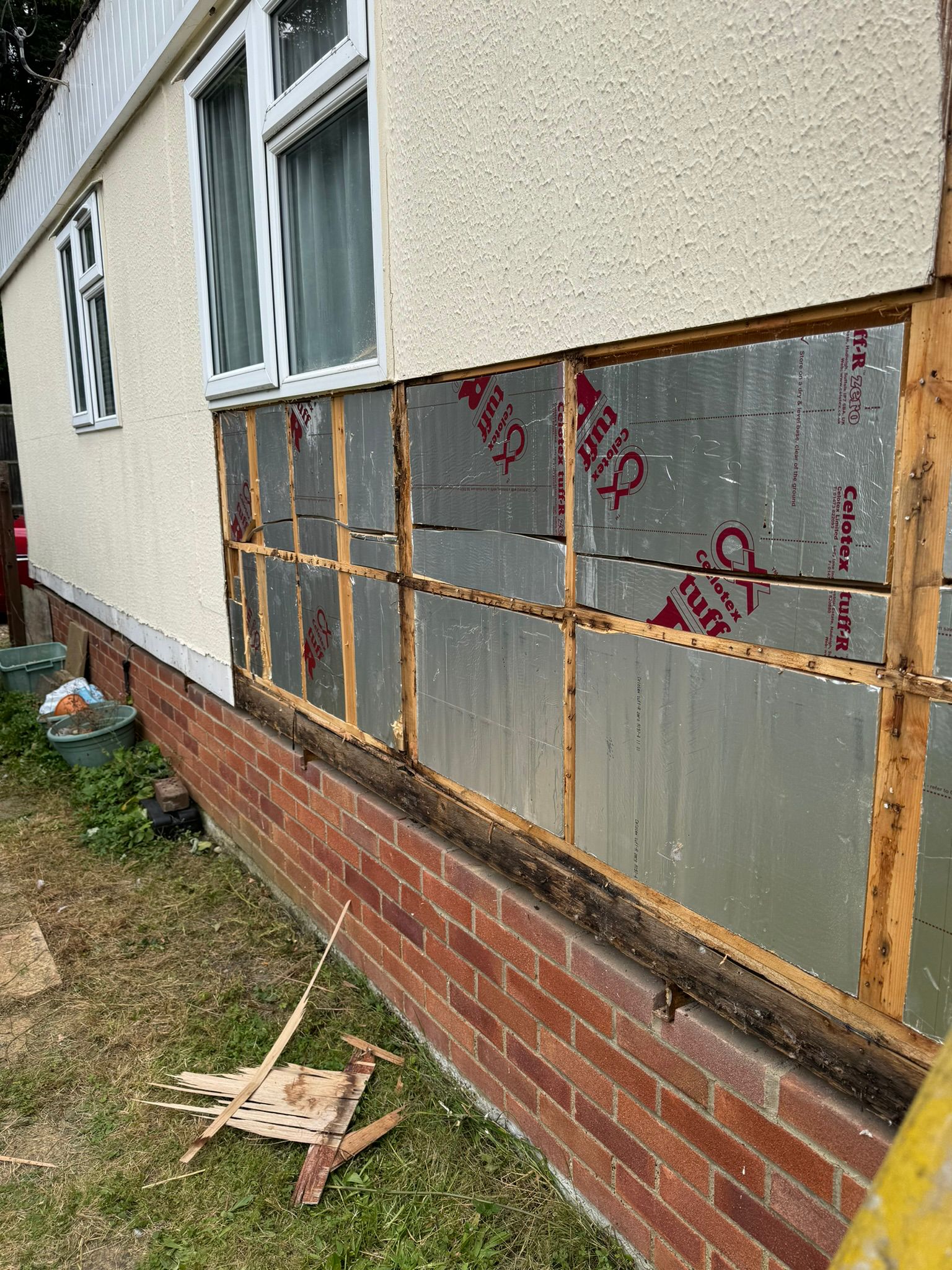 Celotex Tuff-R insulation boards fitted to the lower wall above the brick base